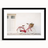 Abstract art print of colorful, textured bicycles on a large canvas, framed in black, ideal for living room decor.