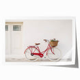 Vintage-style bicycle with floral basket on a rolled canvas print, suited for dining room or bathroom decor.