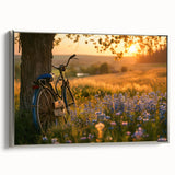 Vintage poster art of a bicycle, rendered in black with colorful accents on a silver-framed canvas.