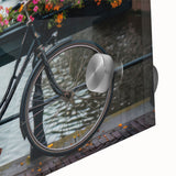 Mid-century modernist art featuring a large abstract bicycle design in muted tones on acrylic glass.