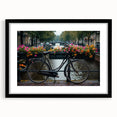 Abstract art print featuring a colorful, textured depiction of bicycles on a large black-framed canvas.