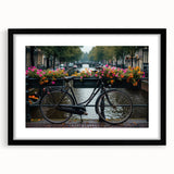 Abstract art print featuring a colorful, textured depiction of bicycles on a large black-framed canvas.
