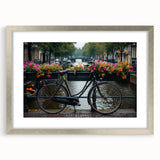 Abstract art print of a stylized bicycle in silver and gray tones on a framed canvas.