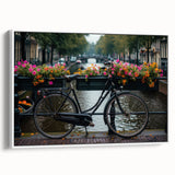 Vintage poster art of a bicycle on a white framed canvas, featuring black and colorful art, ideal for living room decor.