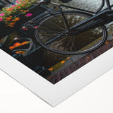 Art deco poster featuring a vintage bicycle, rendered in muted earth tones on a rolled canvas.