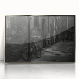 Mid-century modernist art depicting a bicycle in muted pastel colors on a silver-framed acrylic, ideal for nursery wall art.