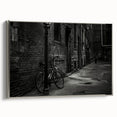 Framed canvas featuring a vintage bicycle in black with colorful background, ideal for living room decor.