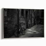 Framed canvas featuring a vintage bicycle in black with colorful background, ideal for living room decor.