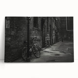 Black and white photo of a vintage bicycle on stretched canvas, ideal for kitchen wall art or bedroom decor.
