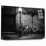 Side view of a bicycle depicted in large abstract style on acrylic glass, using neutral tones.