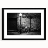 Extra large abstract art print featuring a textured, colorful bicycle design on a black framed canvas.