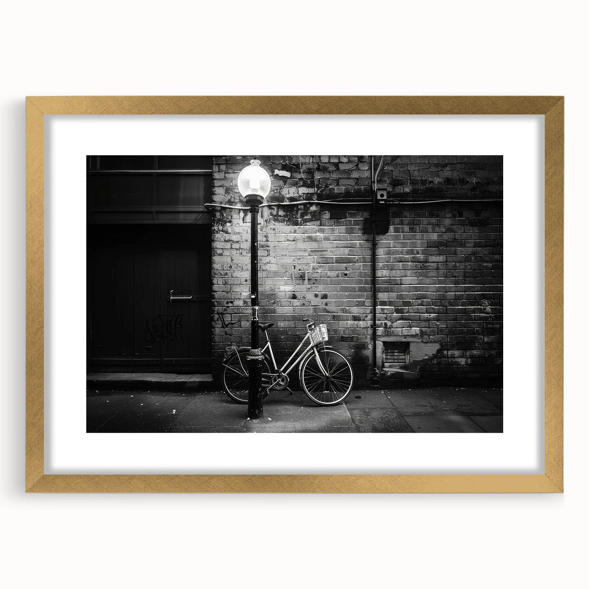 Abstract art print of a bicycle silhouette in gold and black tones, framed with a mat, suitable for dining room decor.