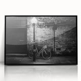 Large abstract wall art featuring a bicycle design in black and white tones on a framed acrylic.