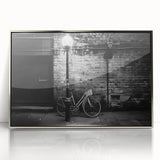Mid-century modernist art depicting a vintage bicycle in muted gray and silver tones on a framed acrylic.