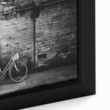 Extra large framed canvas featuring a textured black bicycle on a colorful abstract background, ideal for living room decor.