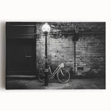 Black and white photo of a vintage bicycle on stretched canvas, ideal for kitchen wall art.
