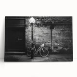 Black and white photo of a vintage bicycle on stretched canvas, ideal for kitchen wall art or bedroom decor.