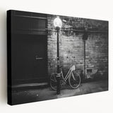 Side view of a vintage bicycle on a large stretched canvas with muted earth tones, suitable for kitchen wall decor.