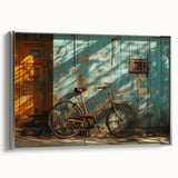 Vintage poster art of a bicycle in black with colorful accents on a silver-framed canvas, suitable for living room decor.