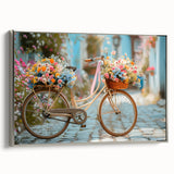 Framed canvas featuring a vintage poster of a black bicycle against a colorful, abstract landscape background.