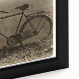 Close-up of a textured black wall art featuring a colorful bicycle design on a framed canvas, ideal for living room decor.