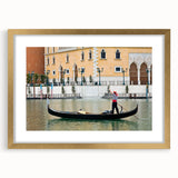 Textured art print of an abstract gondola in muted gold and black tones on a framed canvas, suitable for bedroom decor.
