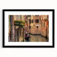Colorful abstract art print of a stylized gondola on a textured canvas, framed in black, ideal for living room decor.