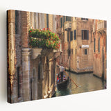 Side view of a stretched canvas featuring a gondola on a muted blue canal, ideal for kitchen wall art.