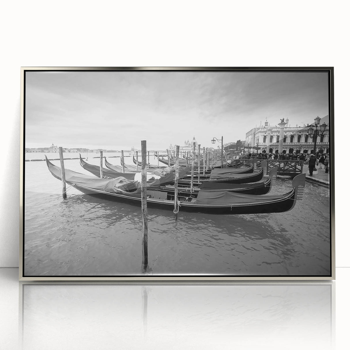 Art deco poster of a silver-framed acrylic print featuring a gondola on water, in muted blues and grays.