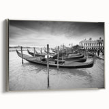 Vintage poster art of a gondola in muted black and colorful accents on a silver-framed canvas, ideal for living room decor.