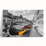 Black and white photograph of a gondola on calm water, printed on large stretched canvas.