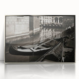 Art deco poster featuring a silver-framed acrylic print of a gondola on water, in muted blue and gray tones.