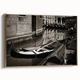 Framed canvas depicting a vintage-style gondola on a river, with a black and colorful art palette.