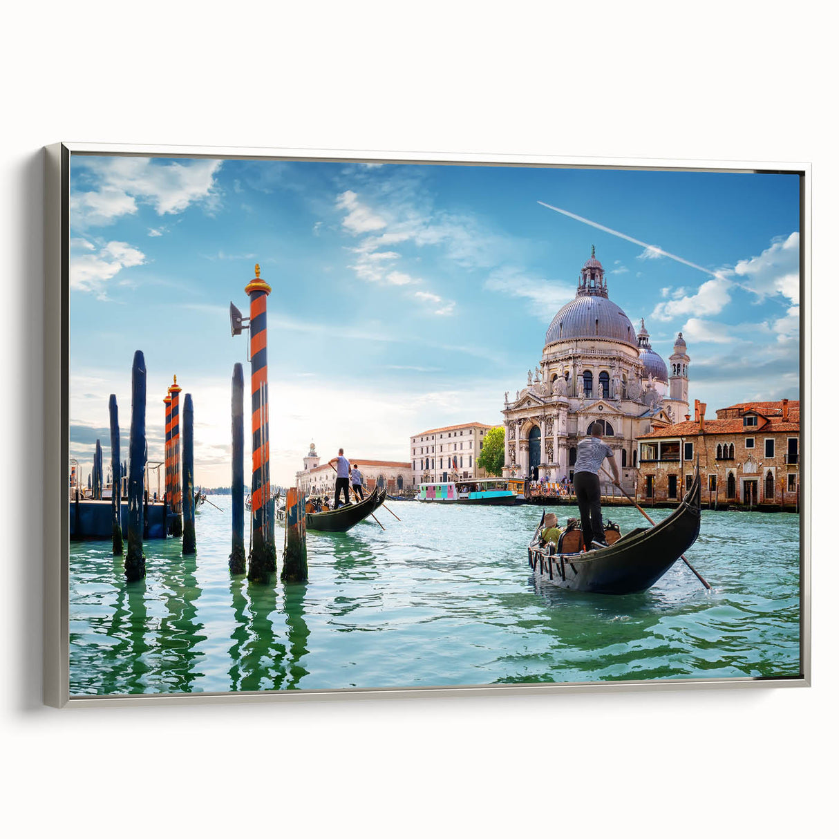 Vintage poster art of a gondola on a canal, rendered in black with colorful accents on a silver-framed canvas.