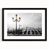 Abstract art print of colorful gondolas on textured canvas, framed in black, ideal for living room decor.