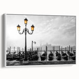 Framed canvas of a vintage poster depicting a gondola on a muted black and gray landscape, ideal for bedroom wall art.