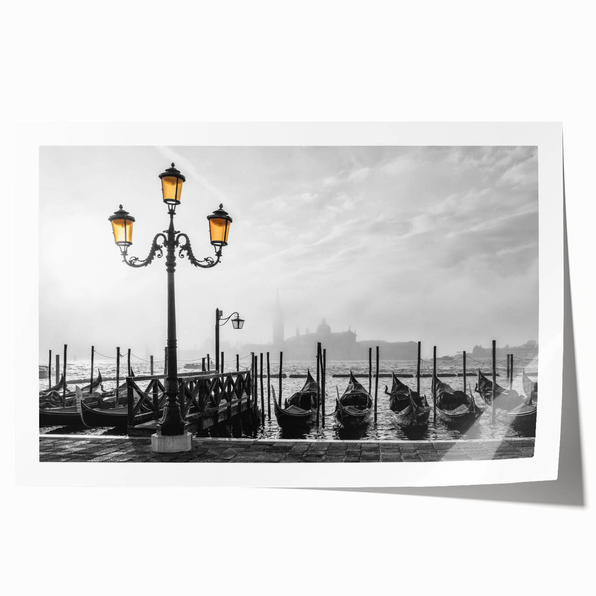 Rolled print of a gondola on a calm river, depicted in muted blues and grays, suitable as art wall dining room decor.