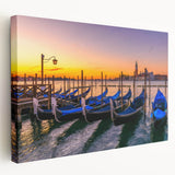 Venetian gondola in calm waters on stretched canvas, depicted in rich blues and grays, suitable for kitchen wall art.