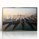 Mid-century modernist art deco poster of a gondola on water, in gold frame, using muted earth tones.