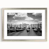 Abstract art print of a stylized gondola in muted blue and gray tones on a framed silver mat, suitable for dining room decor.