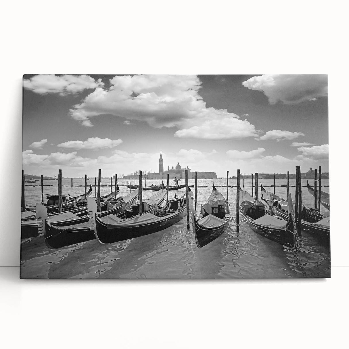Black and white photo of a gondola on calm waters, printed on large stretched canvas.
