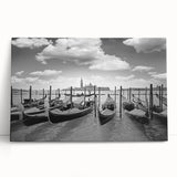 Black and white photo of a gondola on calm waters, printed on large stretched canvas.