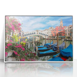 Framed acrylic print of a gondola on a serene blue canal, in a mid-century modernist style.