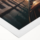 Art deco poster of a gondola on serene water in muted blues and grays on rolled canvas.