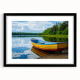 Colorful abstract art print of a rowboat, in vibrant blue and orange hues on a textured canvas, framed in black.