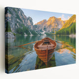 A side view of a rowboat on a calm lake depicted in muted blues and grays on a stretched canvas.