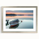 Abstract art print of a rowboat in muted blue and gray tones on a silver-framed mat, suitable for dining room decor.