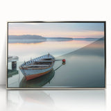 Art deco poster of a rowboat in muted blue and silver tones, acrylic print in silver frame.