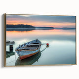 Framed canvas depicting a vintage rowboat in muted black and gold tones, ideal for living room or office decor.