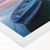 Art deco poster of a rowboat on calm waters, executed in soft blue and gray tones on rolled canvas.